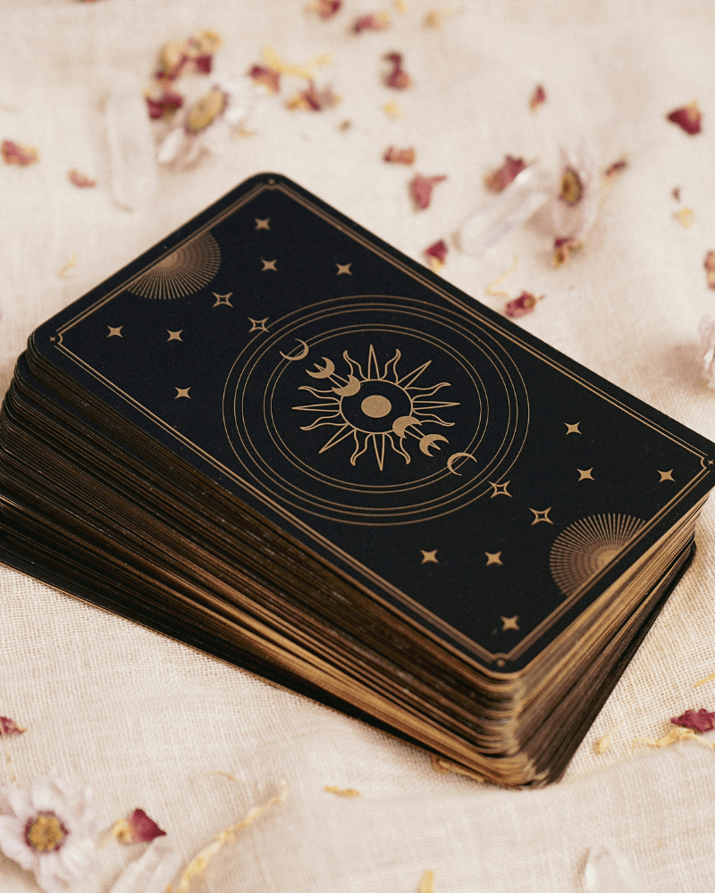 A deck of tarot cards is laid on a linen on Wise Path Tarot's website, a tarot reader in Long Beach CA