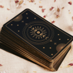 A deck of tarot cards is laid on a linen on Wise Path Tarot's website, a tarot reader in Long Beach CA